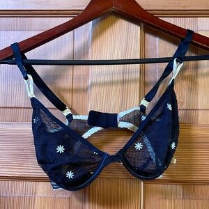 Victoria’s Secret black and daisy bra